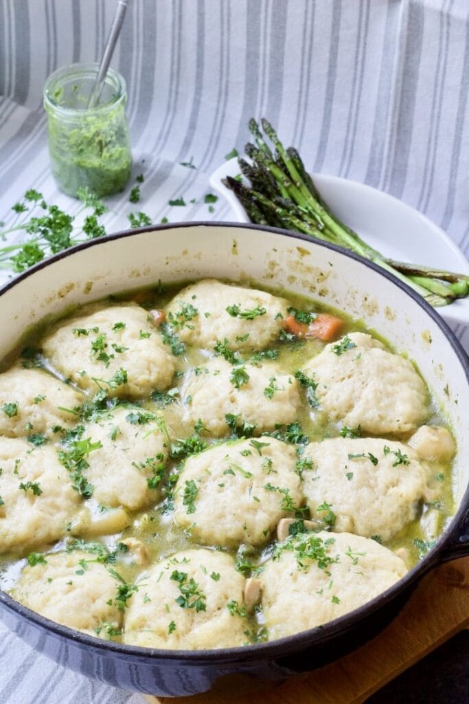 Wild Garlic Chicken Stew with Cheesy Dumplings in a pot