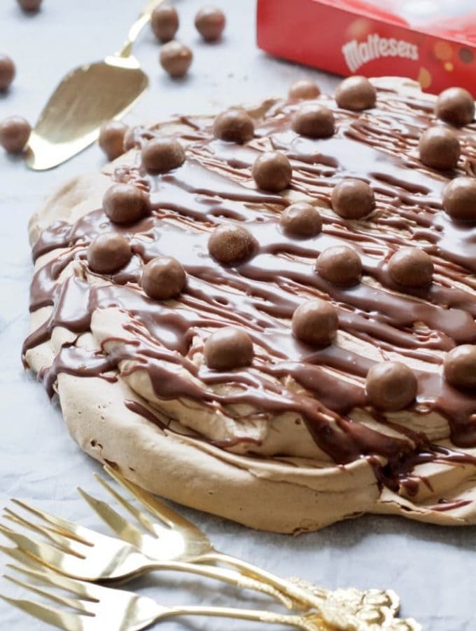 Chocolate Pavlova, cutlery & Maltesers.